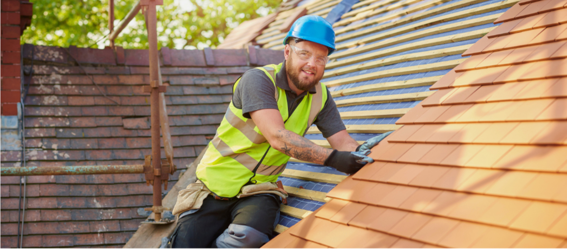 Roofer performing a roof inspection in Tulsa